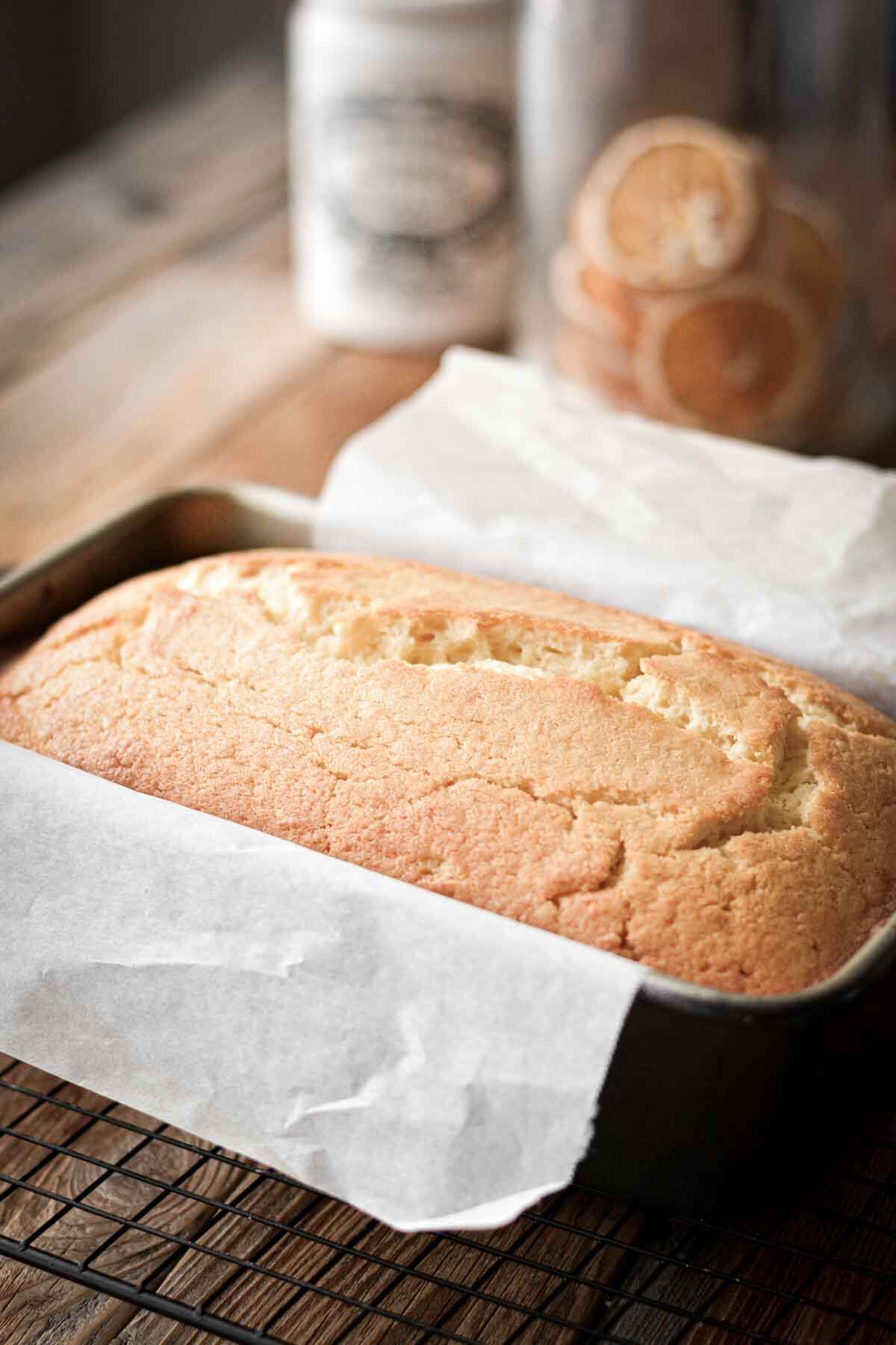 Lemon loaf cake in a baking pan.