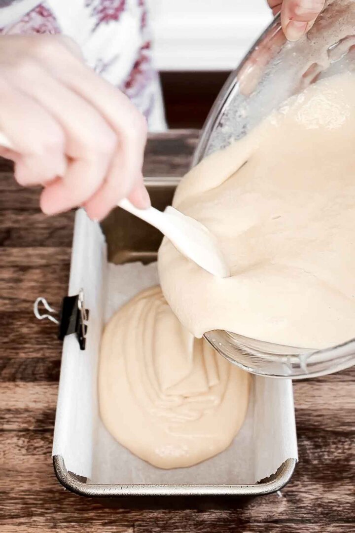 Swirling together vanilla cake batter with poppy seeds.