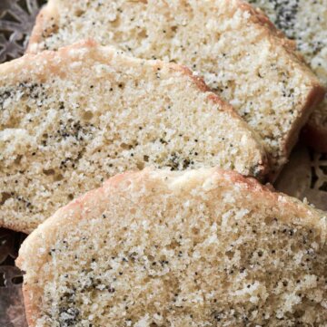 Slices of poppy seed cake on a vintage plate.