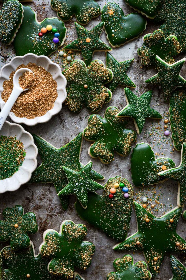 Gold and green iced St. Patrick's day sugar cookies cut in stars, hearts and four leaf clovers.