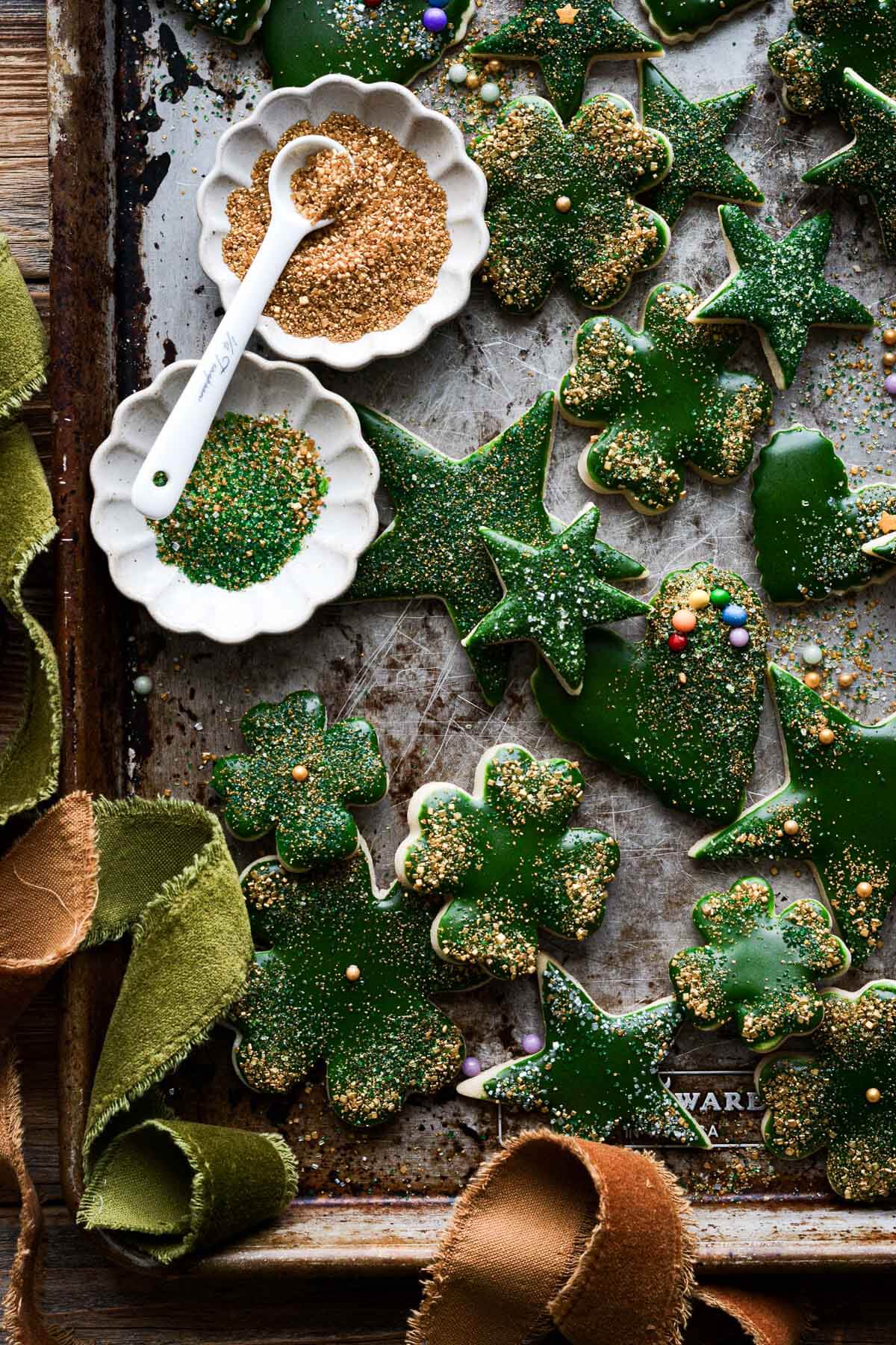 Gold and green iced St. Patrick's day sugar cookies cut in stars, hearts and four leaf clovers.