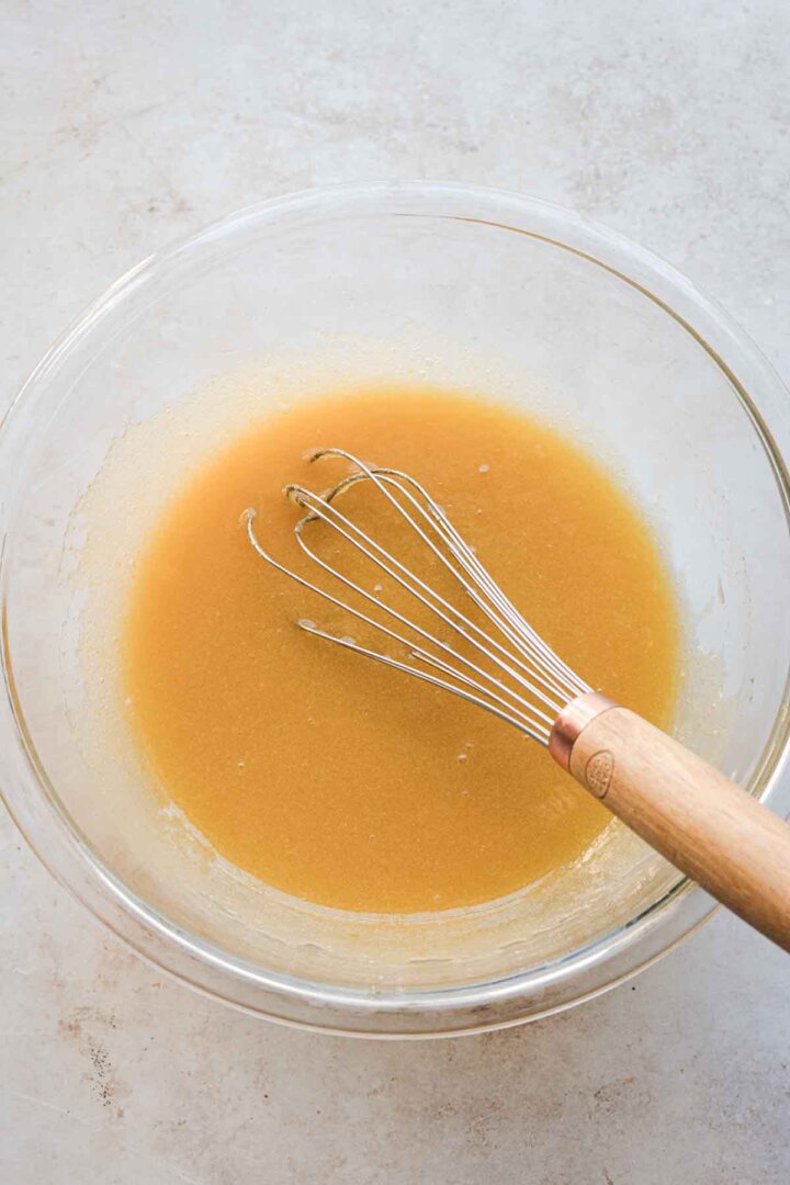 Step 2 for making German chocolate cookies: whisking liquid ingredients.