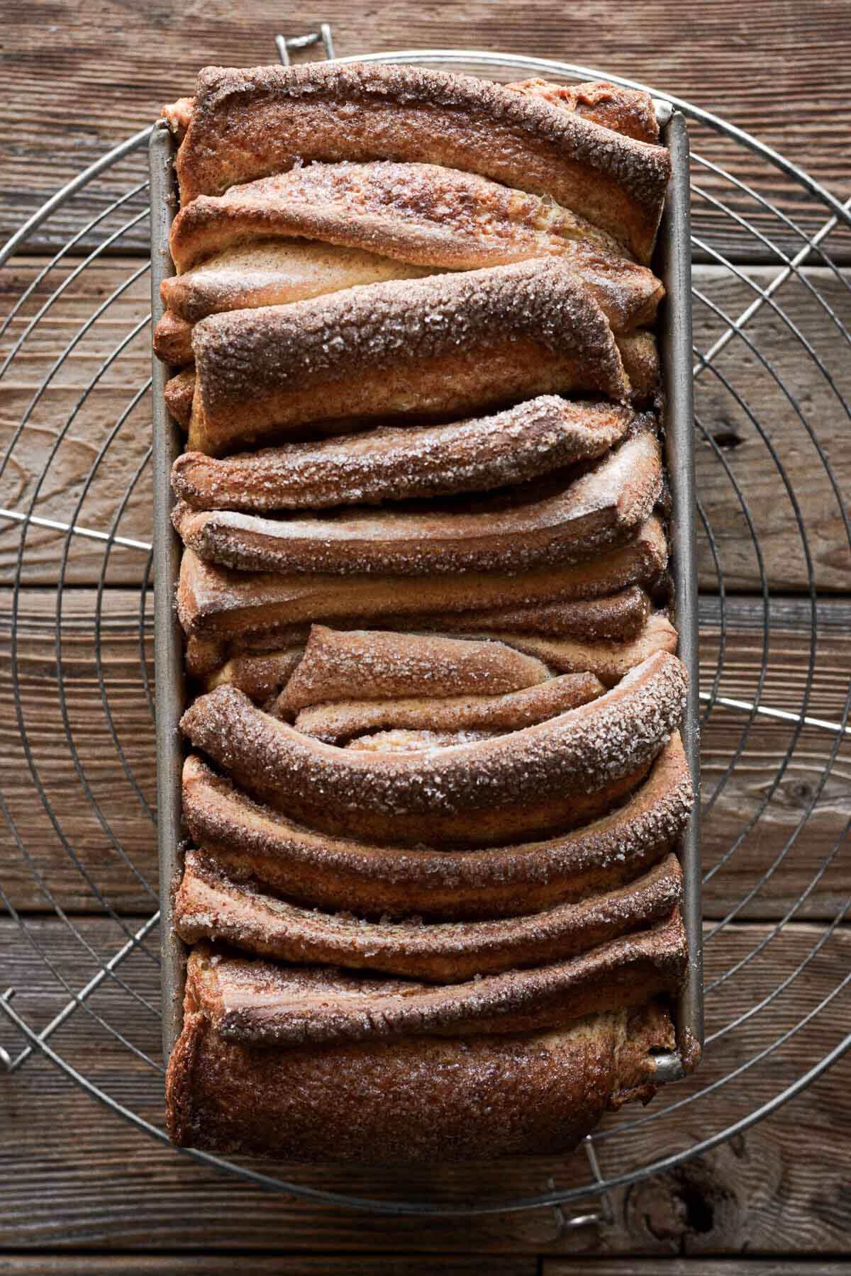 Just baked cinnamon sugar pull apart bread in a pan.