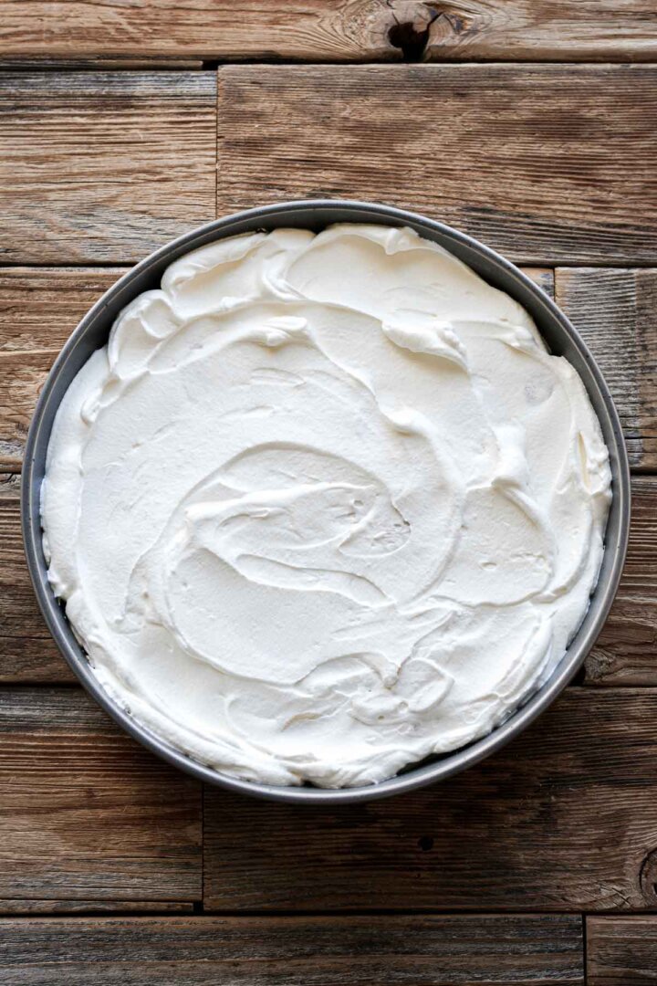 Step 4 for making banana pudding - whipped cream layer.