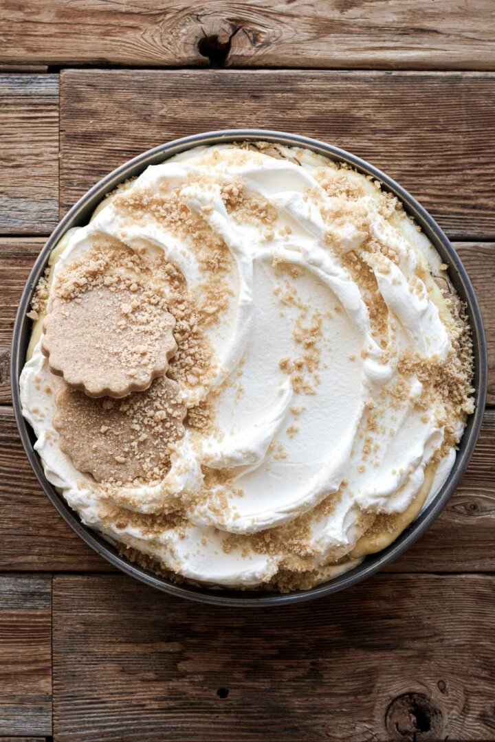 Serving dish of banana pudding, topped with crushed cookies.