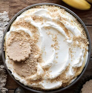 Banana pudding, decorated with whole and crushed shortbread cookies.