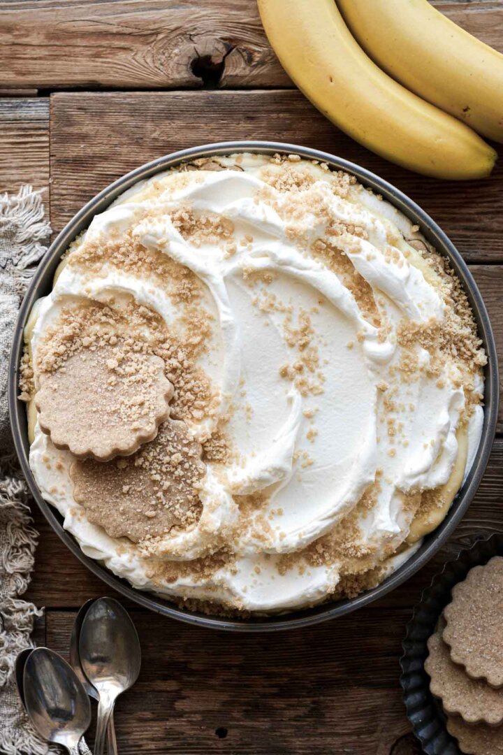 Banana pudding, decorated with whole and crushed shortbread cookies.