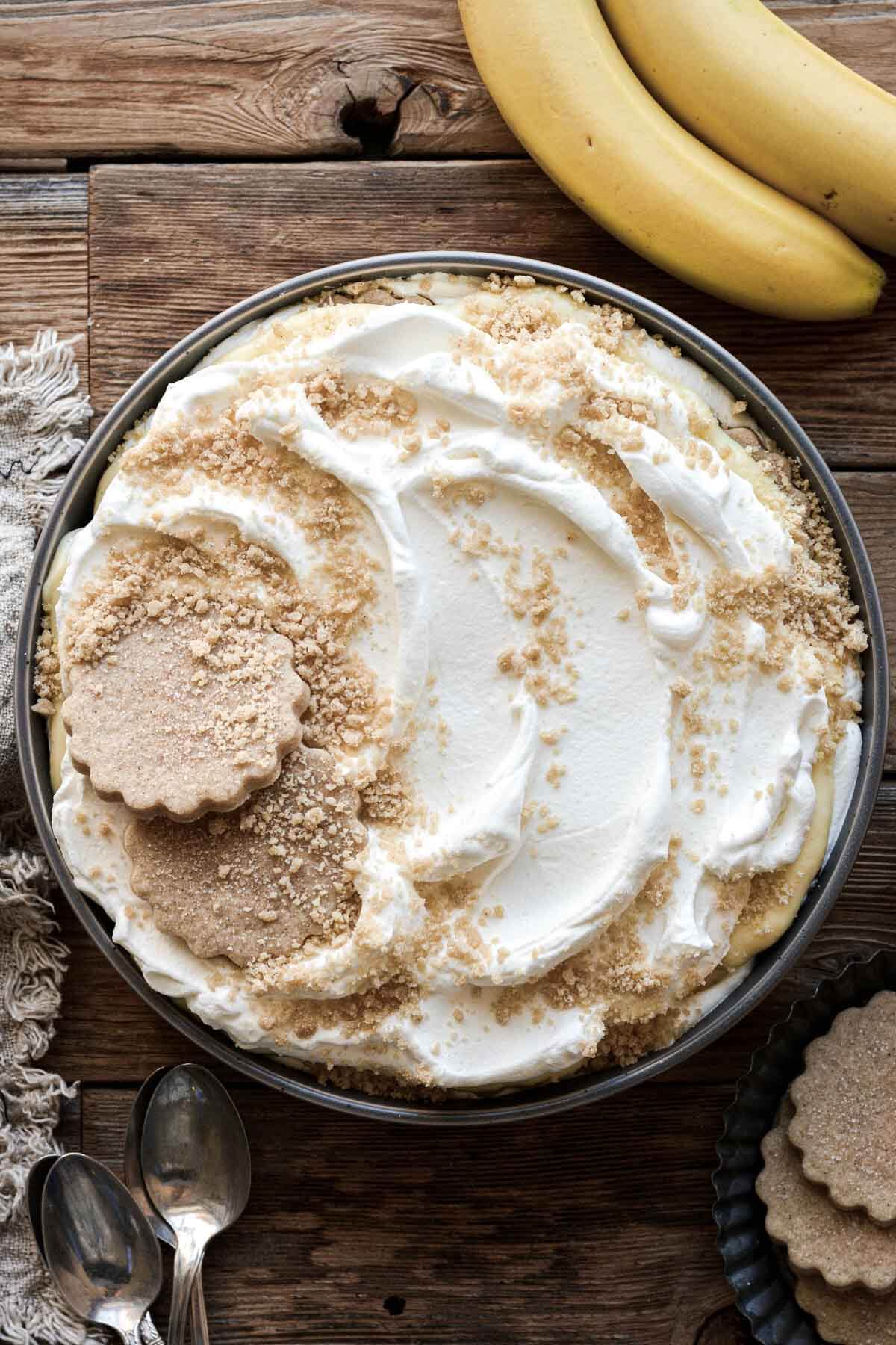 Banana pudding, decorated with whole and crushed shortbread cookies.