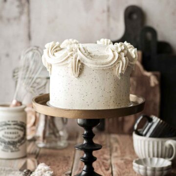 London fog layer cake, on a black and gold cake stand.