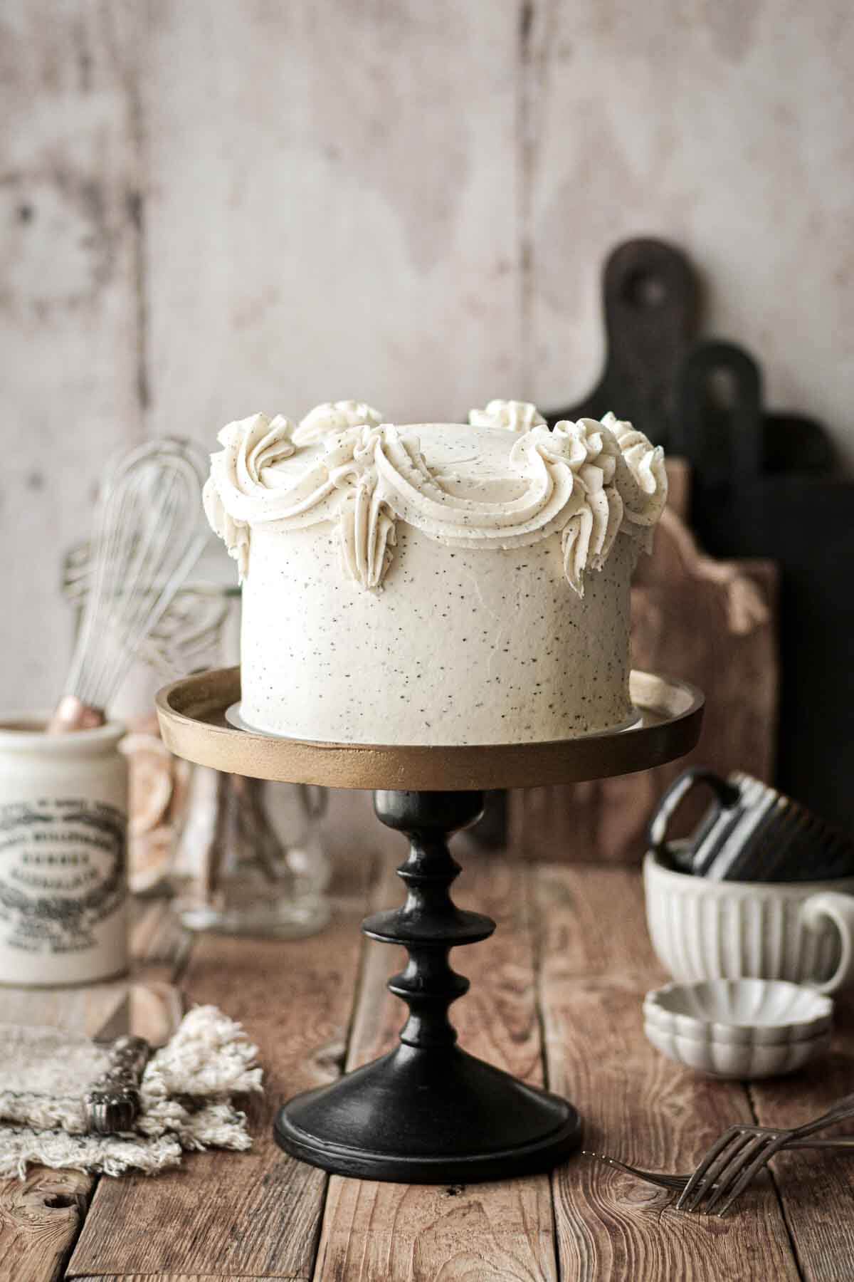 London fog layer cake, on a black and gold cake stand.