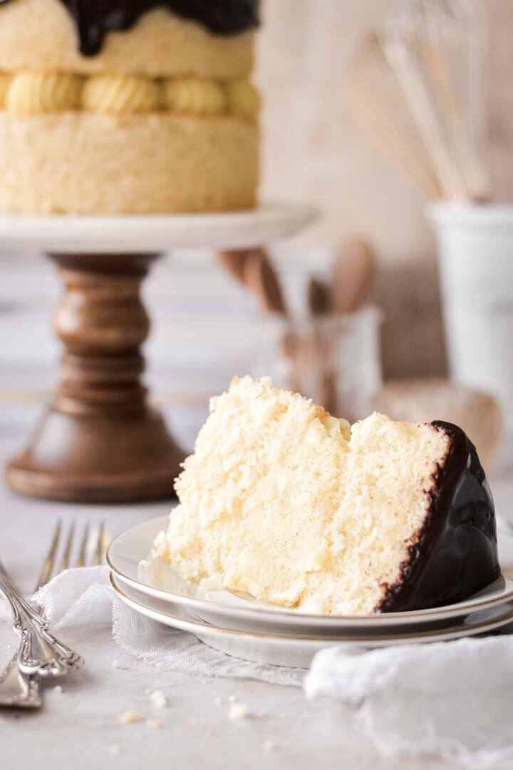 Slice of Boston cream pie cake on a plate.