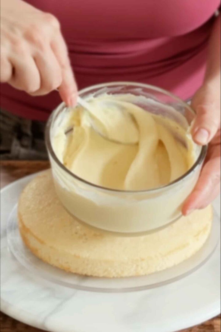 Stirring a bowl of vanilla custard.
