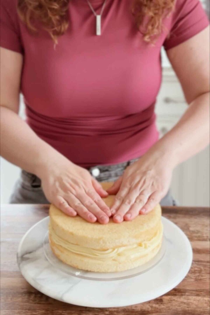 Assembling a Boston cream pie.