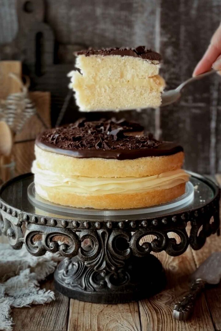 Cutting a slice of Boston cream pie.