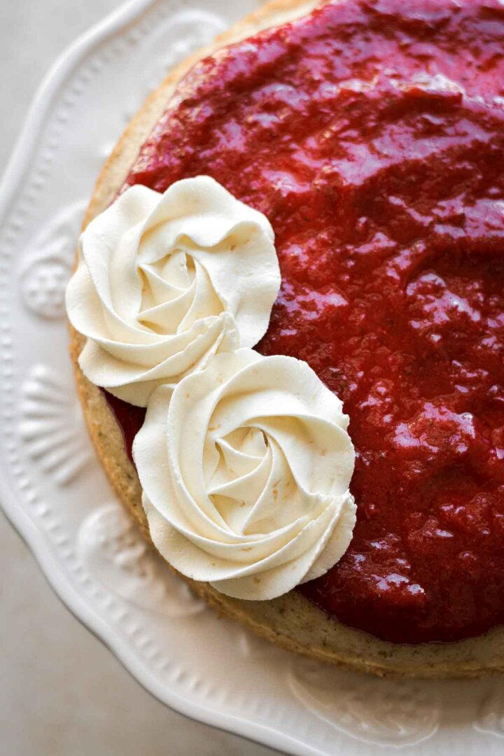 Buttercream piped in rosettes over strawberry rhubarb compote.