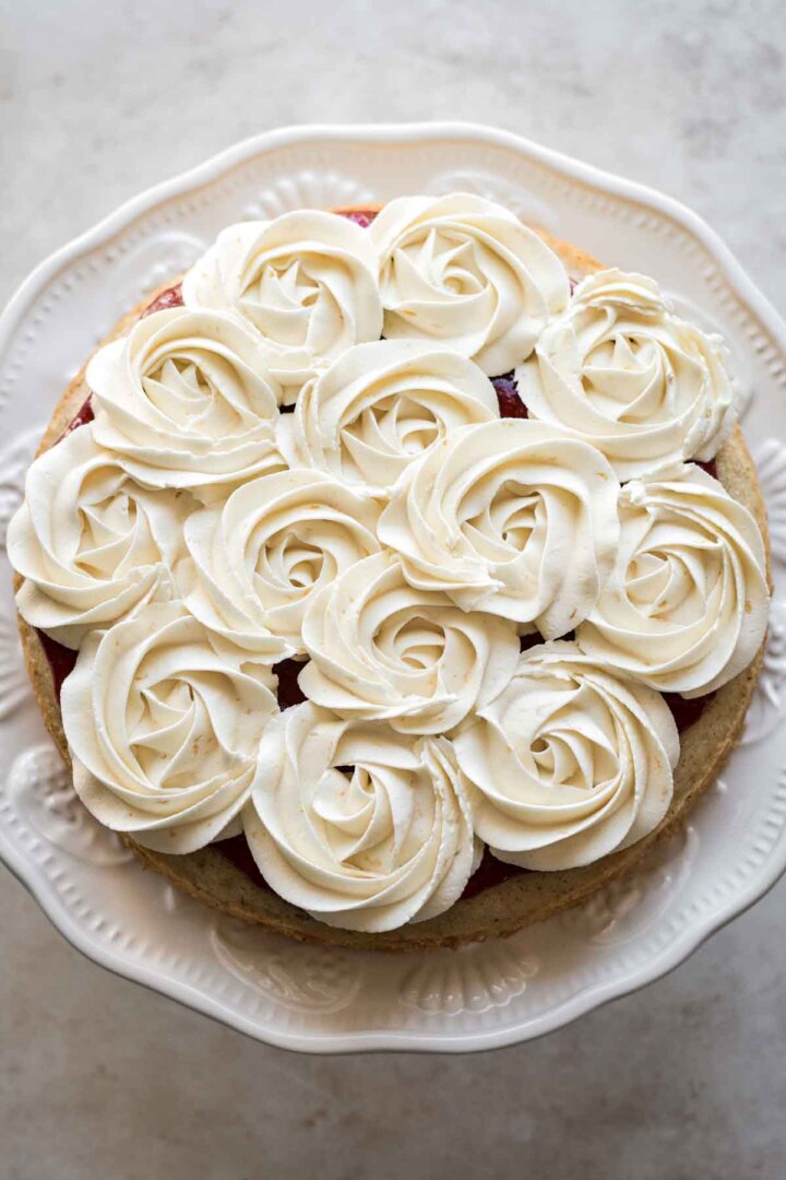 Buttercream rosettes piped onto a cake.