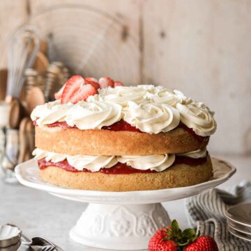 Strawberry chamomile cake - a naked cake with layers of strawberry rhubarb compote and honey orange buttercream.