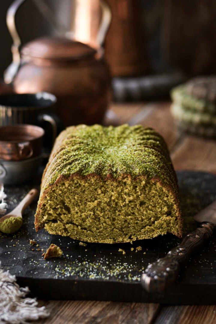 Matcha loaf cake with a slice cut.