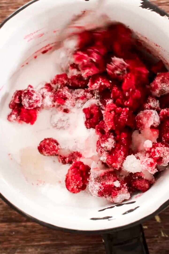 Step 1 for making raspberry ice cream - simmer raspberries with sugar.
