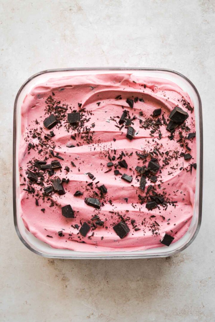 Raspberry ice cream, sprinkled with chopped chocolate.