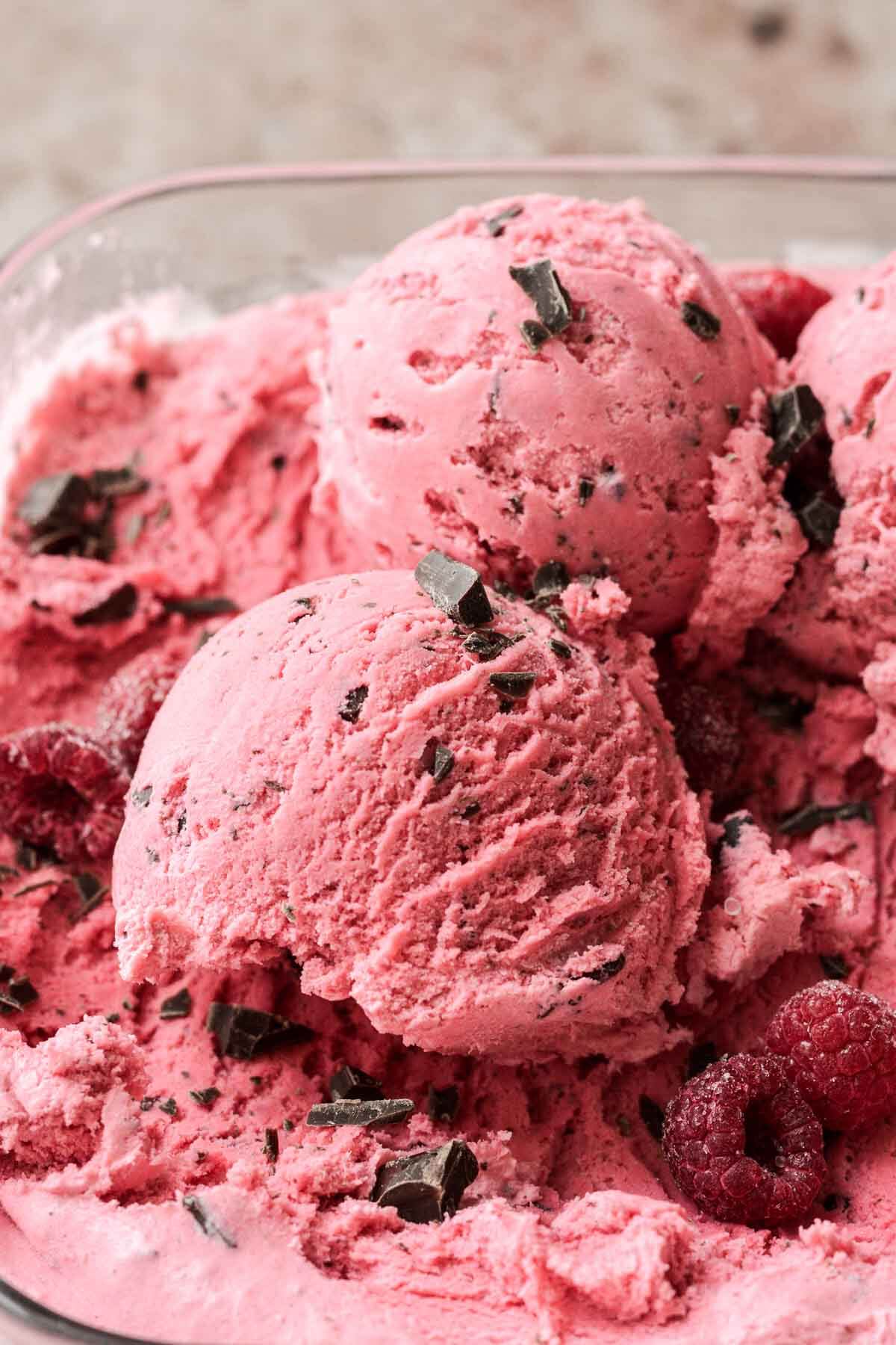 Scoops of raspberry chocolate chunk ice cream.