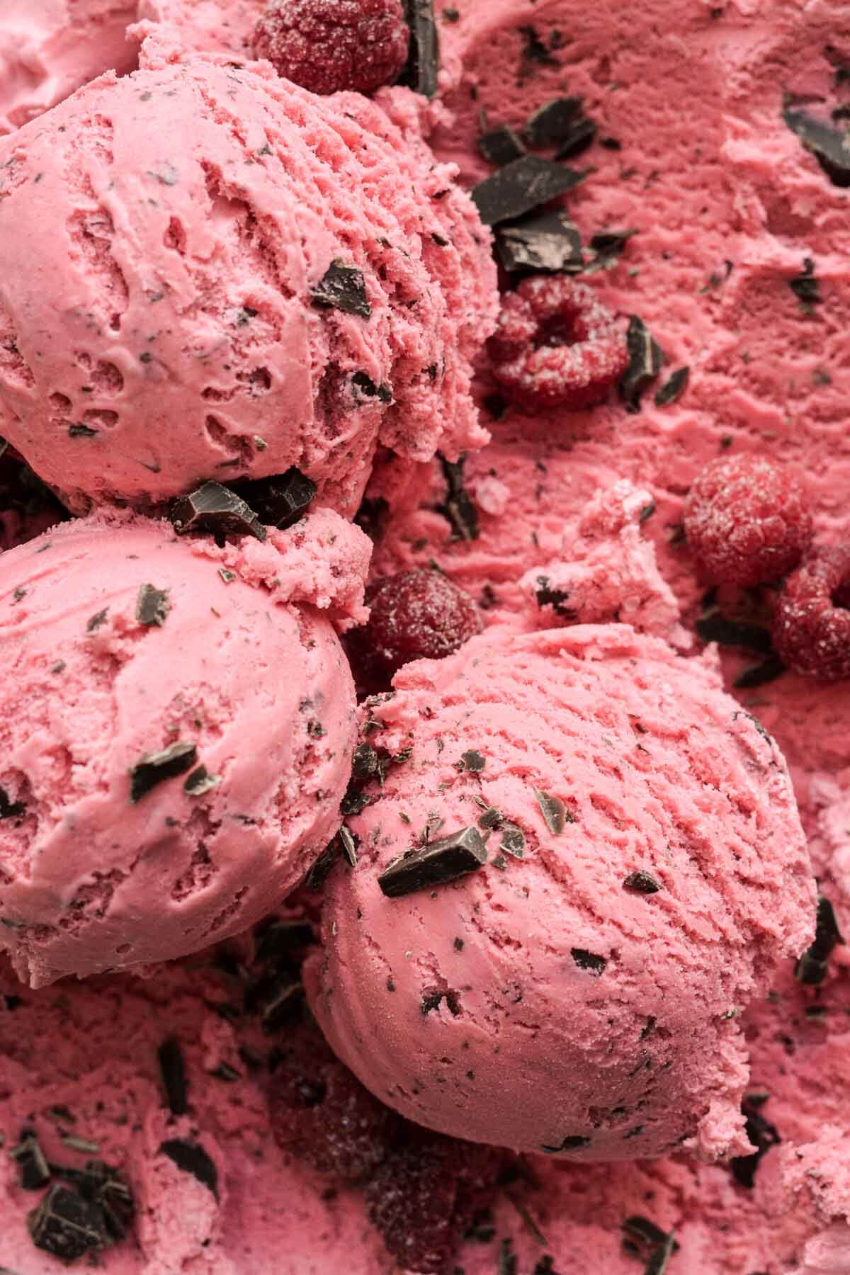 Scoops of raspberry chocolate chunk ice cream.