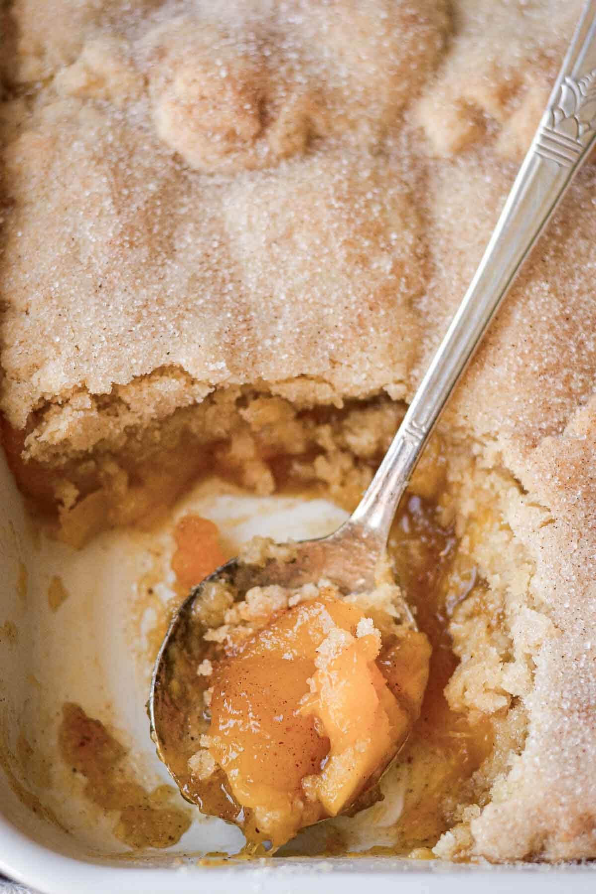 Mango cookie cobbler with a spoonful of filling.