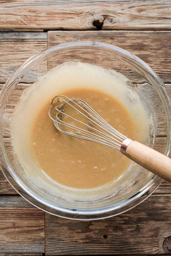 Step 2 for making matcha chocolate chip cookies - mixing liquid ingredients.