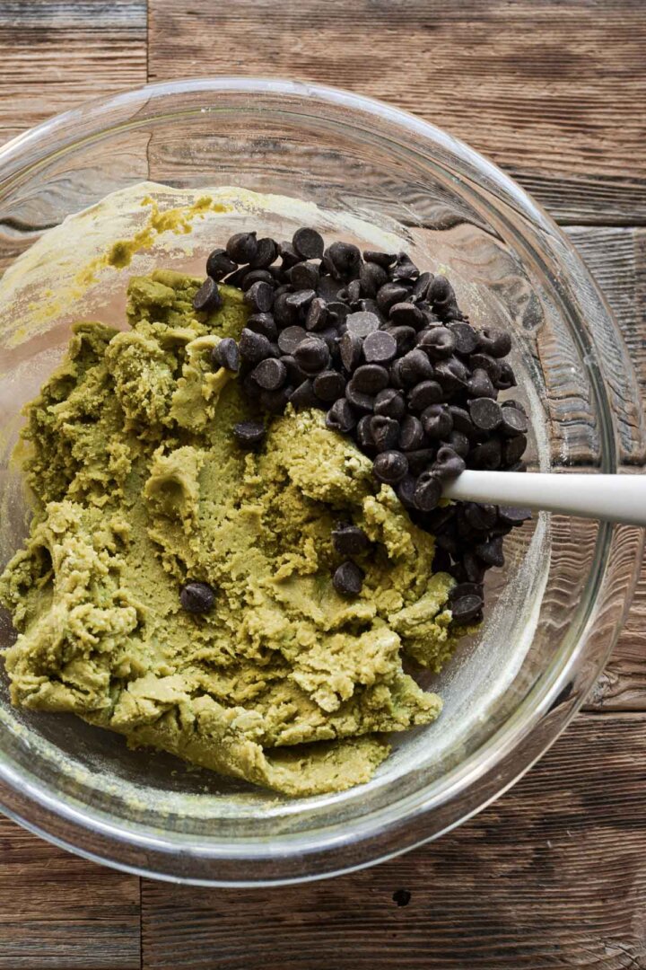 Step 6 for making matcha chocolate chip cookies - adding chocolate chips.