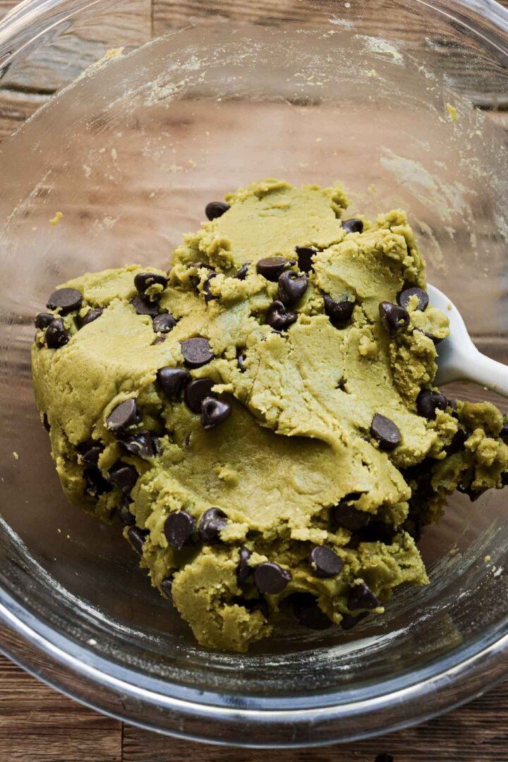 Step 7 for making matcha chocolate chip cookies - adding chocolate chips.