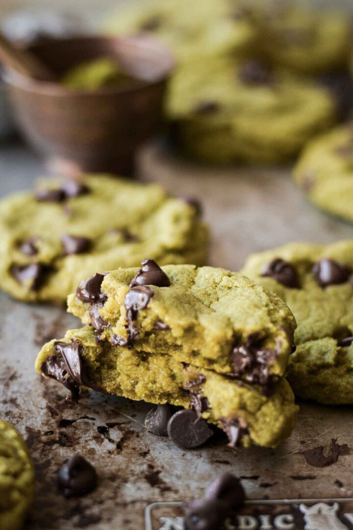 Matcha chocolate chip cookie broken in half.