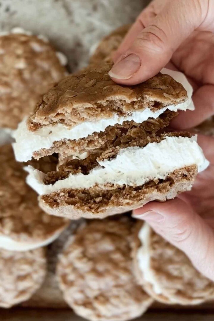 Oatmeal cream pie, broken in half.