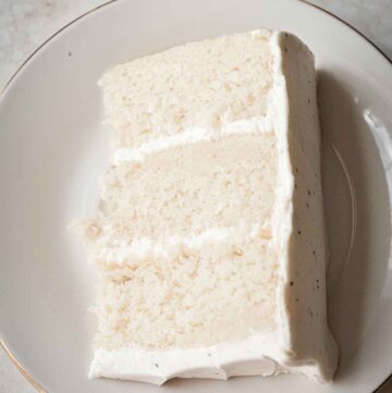 Slice of white velvet cake on a plate.