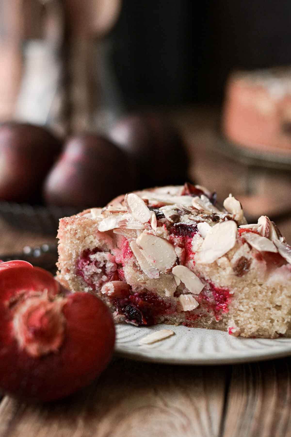 Slice of almond plum cake.