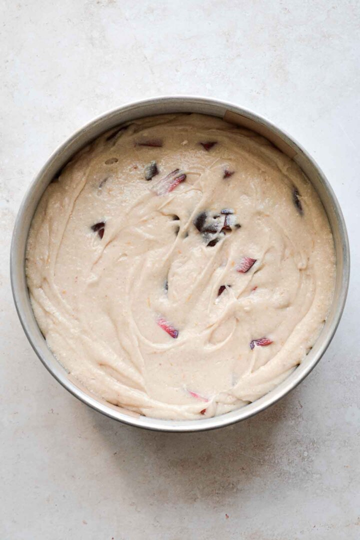 Step 1 for making almond plum cake - batter in pan.