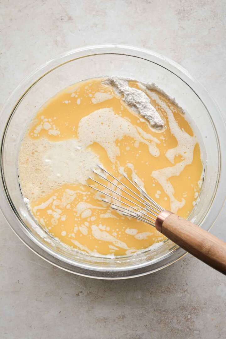 Step 1 for making vanilla cupcake batter - adding wet ingredients.