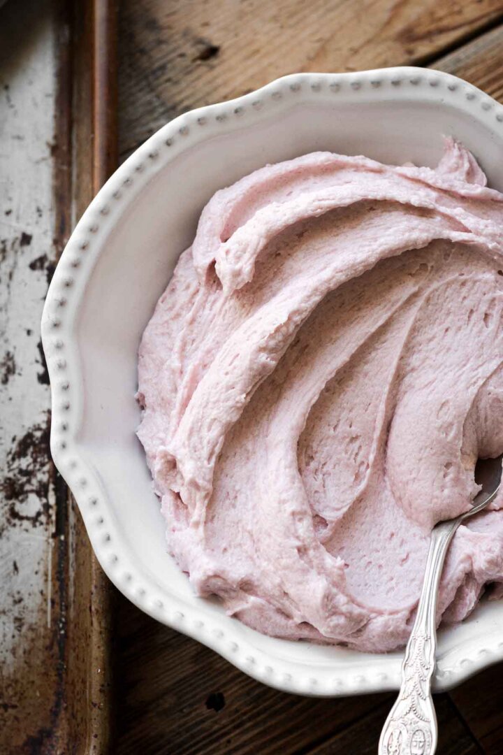 Bowl of pink buttercream.