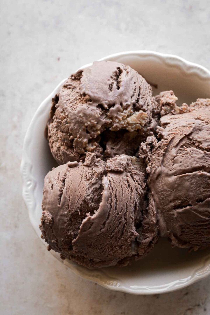Scoops of German chocolate cake ice cream in a bowl.