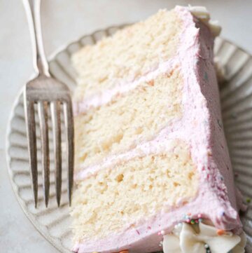 Slice of gluten free vanilla birthday cake.
