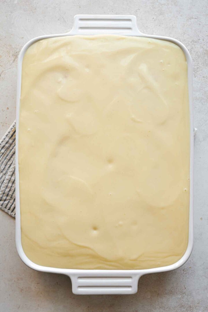 Lime pudding poured over a cake.