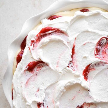 Strawberry pudding, layered in a white pie pan.