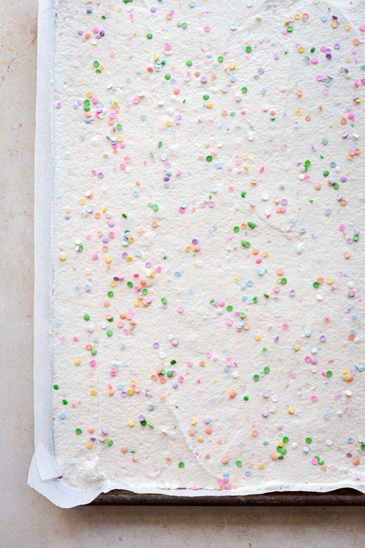 Sprinkle cake batter in a rimmed baking sheet.