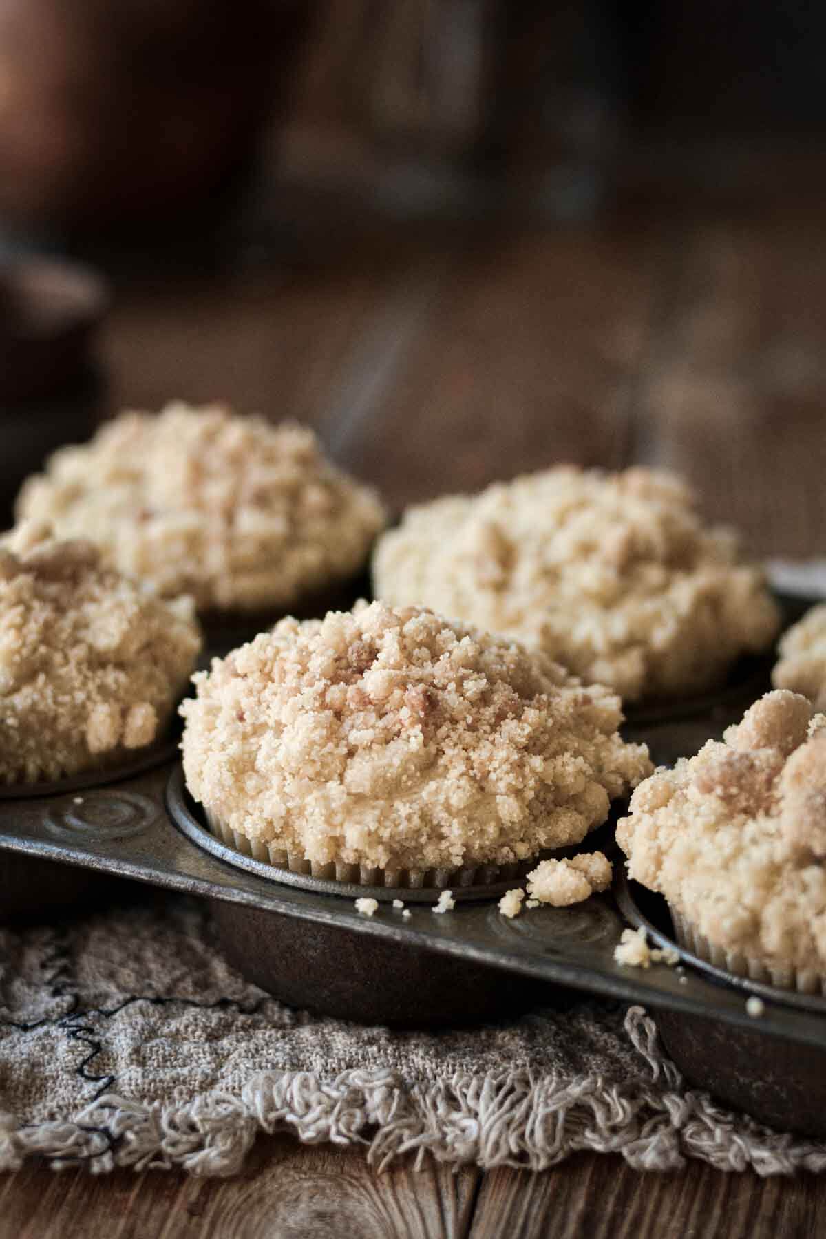 Almond poppy seed muffins in a vintage pan.