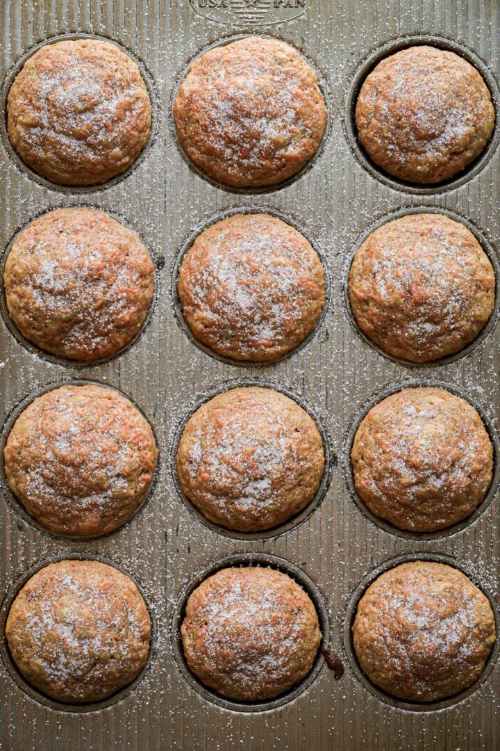 Step 6 for making carrot cake muffins - baked muffins in a muffin pan.