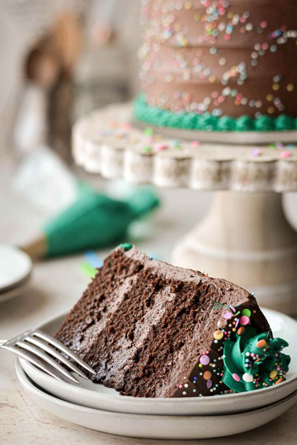 Slice of gluten free chocolate birthday cake.