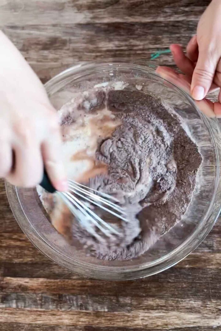 Step 3 for making gluten free chocolate cake batter - adding liquid ingredients.