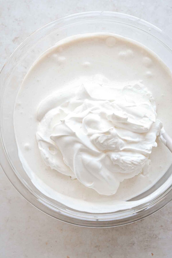 Step 2 for making oatmeal cookie ice cream - folding in whipped cream.