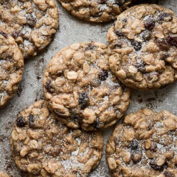 Oatmeal raisin cookies on a baking sheet.