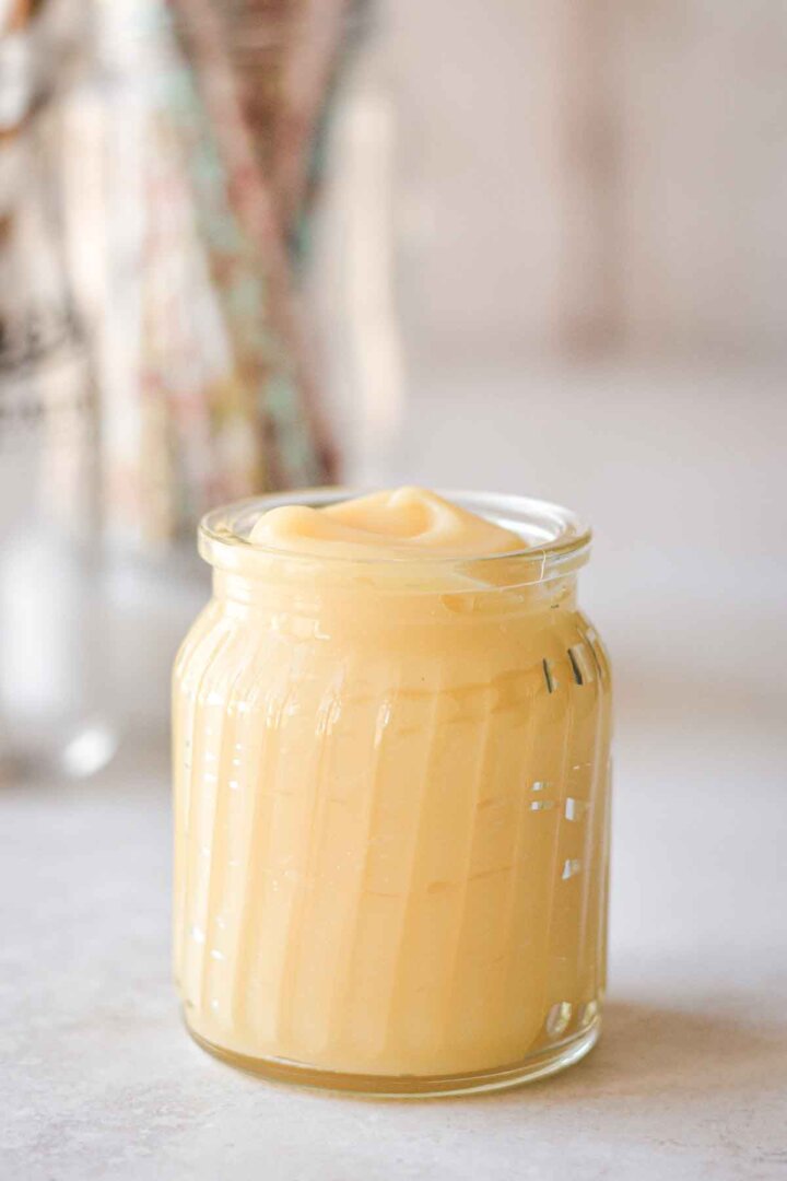 Glass jar of pineapple curd.