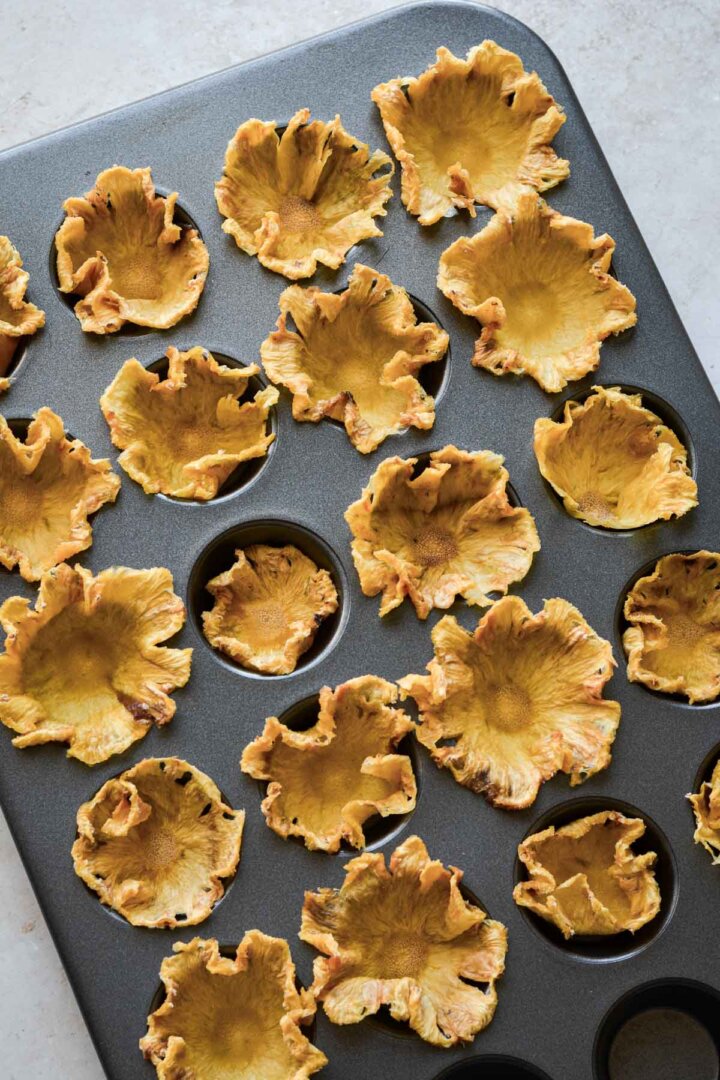 Dried pineapple slices, molded into flowers.